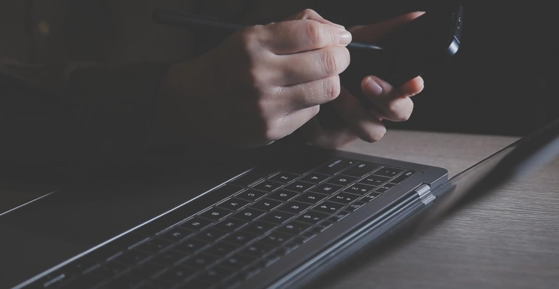 Business professional reviewing automated financial reports on multiple screens